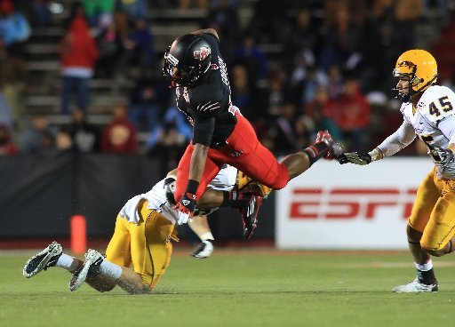 Arkansas State Michael Gordon goes high over Kent State Dana Brown during their game at Ladd-Pebbles Stadium, in Mobile, Ala. Sunday.