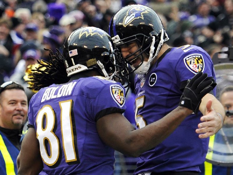 Baltimore Ravens wide receiver Anquan Boldin (81) celebrates his touchdown catch with quarterback Joe Flacco (5) during the fourth quarter of Sunday’s wild-card playoff game against the Indianapolis Colts in Baltimore. Boldin had five catches for 145 yards. 
