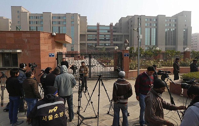 Television crews take positions in front of the Saket district court where the accused in a gang rape are being tried Monday, in New Delhi, India. 