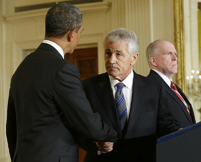 President Barack Obama greets former Nebraska Sen. Chuck Hagel (center) after announcing Hagel’s nomination for defense secretary on Monday in Washington. Obama also announced that he is nominating John Brennan (right) as the new CIA director.

