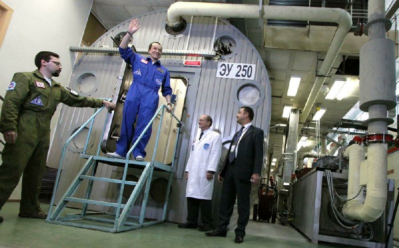 Researcher Sukhrob Kamolov leaves a set of windowless modules after a grueling 520-day simulation of a flight to Mars in this November 2011 photo. 