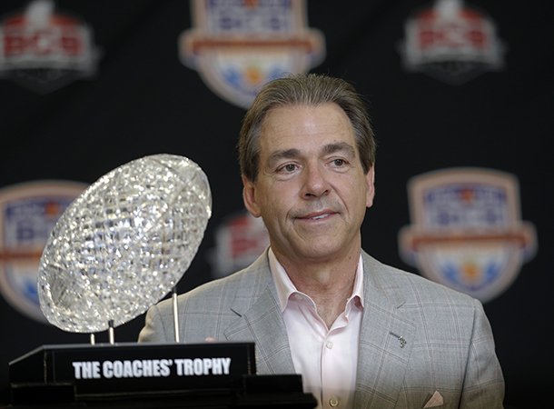 Alabama head coach Nick Saban poses with The Coaches' Trophy during a BCS National Championship college football game news conference Tuesday, Jan. 8, 2013, in Ft. Lauderdale, Fla. Alabama defeated Notre Dame 42-14 Monday night to win the national championship. (AP Photo/Morry Gash)