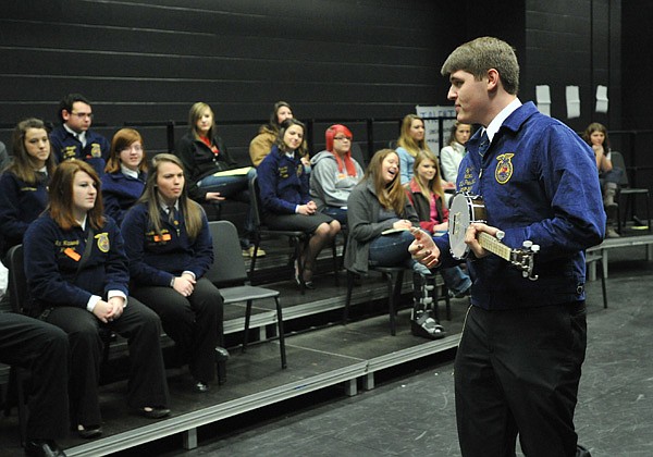 Wiley Bailey, National Vice President for the Future Farmers of America, breaks out his banjo during a workshop Monday morning at Fayetteville High School. Several National FFA officers came to the school to put on workshops for other FFA members from other area schools. 