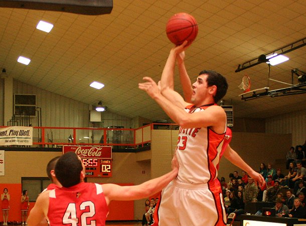 Photo by Randy Moll -- Gravette senior point guard Matt VanOtterloo shoots for two in play against Farmington at Gravette on Tuesday night.