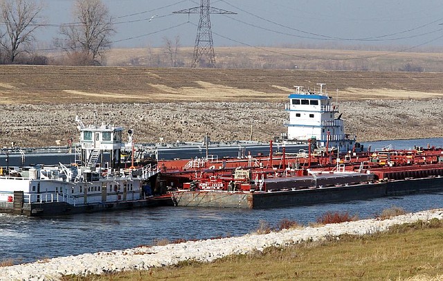 Tows pass each other Monday in the Chain of Rocks Canal just north of Lock No. 27 on the Mississippi River in Granite City, Ill. 