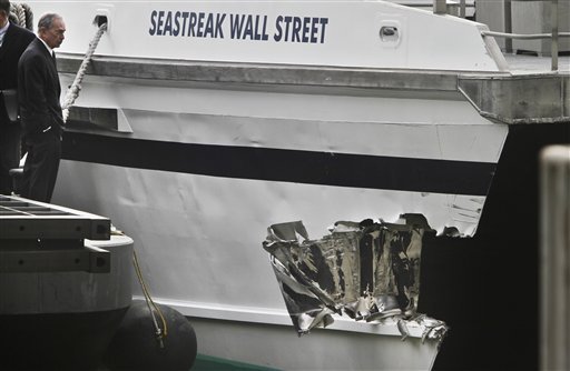 Mayor Michael Bloomberg surveys the damage to a passenger ferry after it crashed on Wednesday, Jan. 9, 2013 in New York. At least 57 people were injured, two critically, when a commuter ferry struck a dock in New York City's financial district, ripping open a right-side front corner.