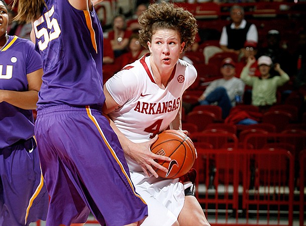 NWA Media/JASON IVESTER -- Arkansas senior Sarah Watkins works around LSU junior Theresa Plaisance during the first half on Thursday, Jan. 10, 2013, at Bud Walton Arena in Fayetteville.