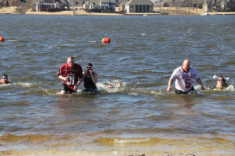 After making the Polar Plunge last year, chilly swimmers return to shore. This year, the volunteers, who gathered pledges to support Special Olympics Arkansas, will jump into the pool of the Hurricane Lake Estates clubhouse for the 2013 Polar Plunge.