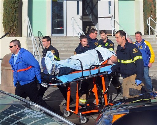 This image provided by the Taft Midway Driller/Doug Keeler shows paramedics transporting a student wounded during a shooting Thursday Jan. 10, 2013 at San Joaquin Valley high school in Taft, Calif. Authorities said a student was shot and wounded and another student was taken into custody. 