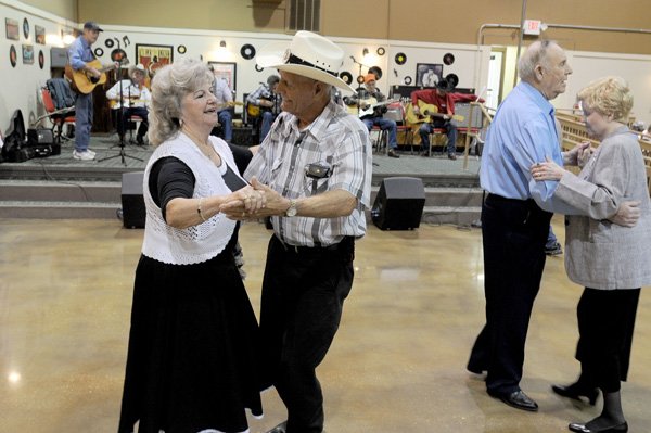 Jewell Barnett and husband Clyde Barnett dance Thursday at the Springdale Senior Center. The Barnetts will celebrate their 56th wedding anniversary later this month and go to many of the senior centers in the county to dance for their health. The center and the city are going to split the cost of paving the center’s parking lot. 