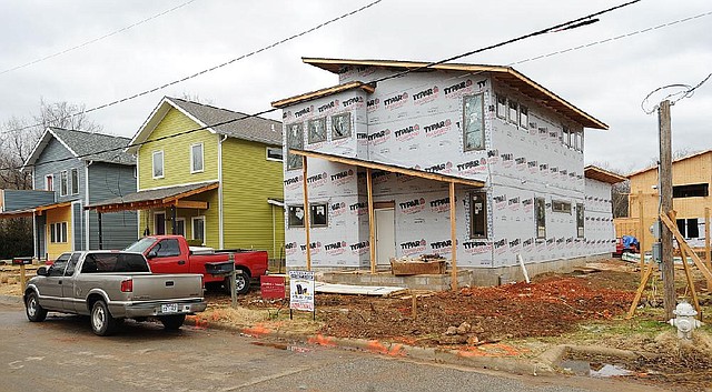 A new house being constructed by Jacobs and Newell Co. takes shape Thursday at 529 S. Block Ave. in Fayetteville. 