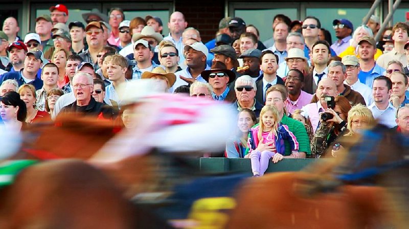 Fans stood shoulder to shoulder on the Oaklawn Park apron Friday in Hot Springs as horses broke from the gate to start the 2013 live racing season, the track’s earliest opening. Track officials said 60-degree temperatures, after last month’s winter storm, might have helped lure a crowd of 19,633, an 8.5-percent increase in on-track attendance over a year ago. On-track wagering was $1,119,168.50, a 10-percent increase over last year’s opening. 