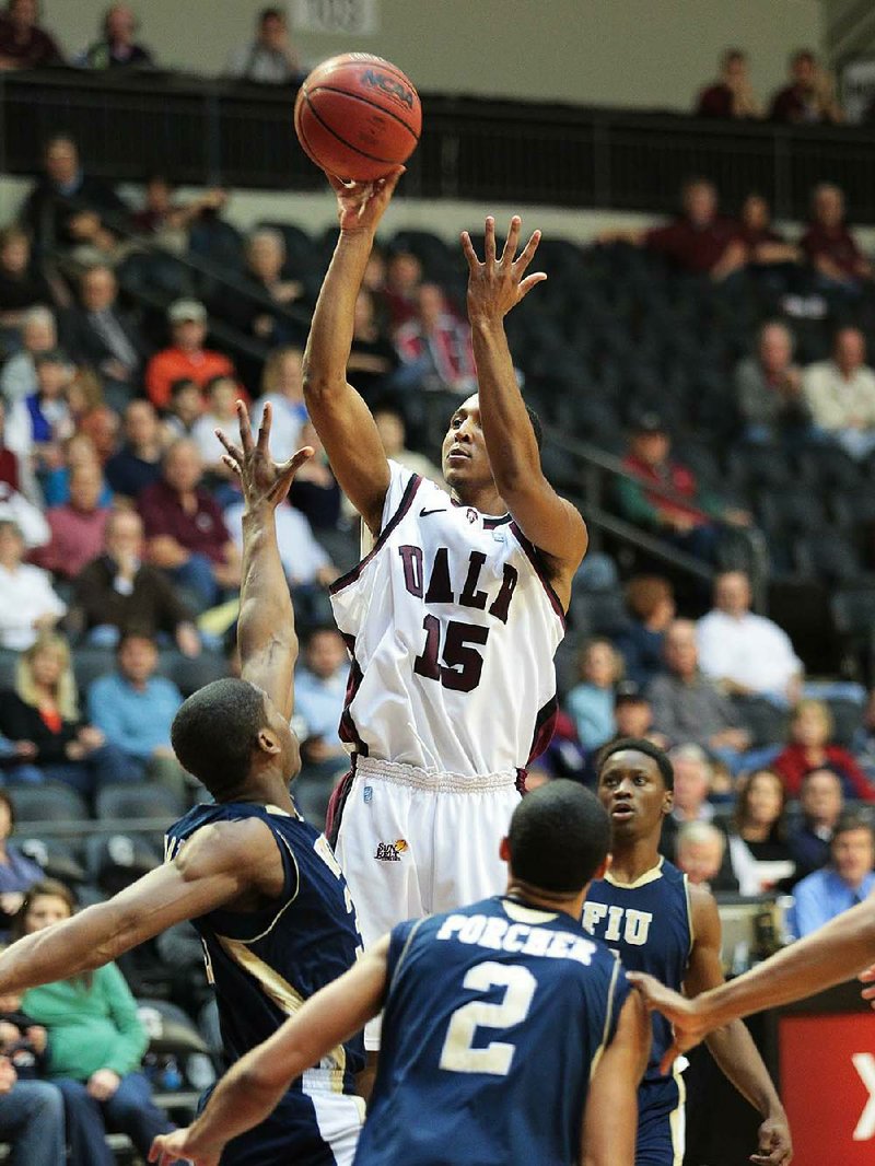 UALR’s Stetson Billings attempts a jumper against Florida International on Saturday afternoon at the Jack Stephens Center in Little Rock. The Trojans beat the Golden Panthers 88-76. 