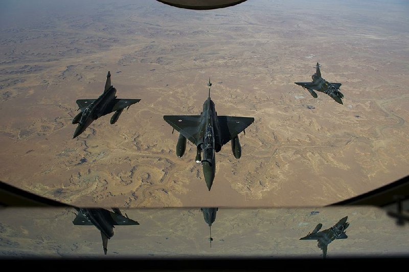 French Mirage 2000D fighters bound for action in Mali refuel after scrambling from a base in neighboring Chad in this photo released by the French army.