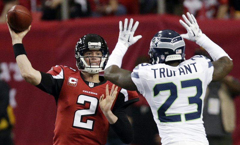 Atlanta Falcons quarterback Matt Ryan (2) throws against Seattle Seahawks cornerback Marcus Trufant (23) during the second half of an NFC divisional playoff NFL football game Sunday, Jan. 13, 2013, in Atlanta. 