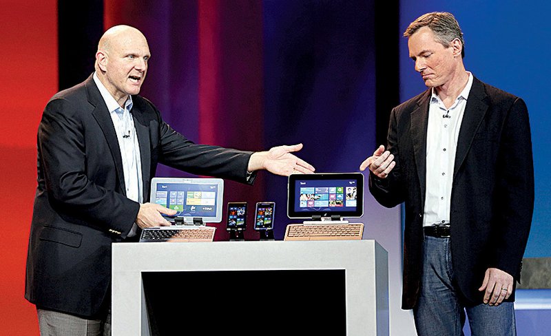 Microsoft Chief Executive Steve Ballmer (left) put in a cameo appearance during the keynote address by Qualcomm Chief Executive Paul Jacobs at last week’s International CES show in Las Vegas. Microsoft sharply pulled back its presence at the show at a time when it is pushing a new operating system designed to improve how desktop computers work with increasingly popular tablets. 