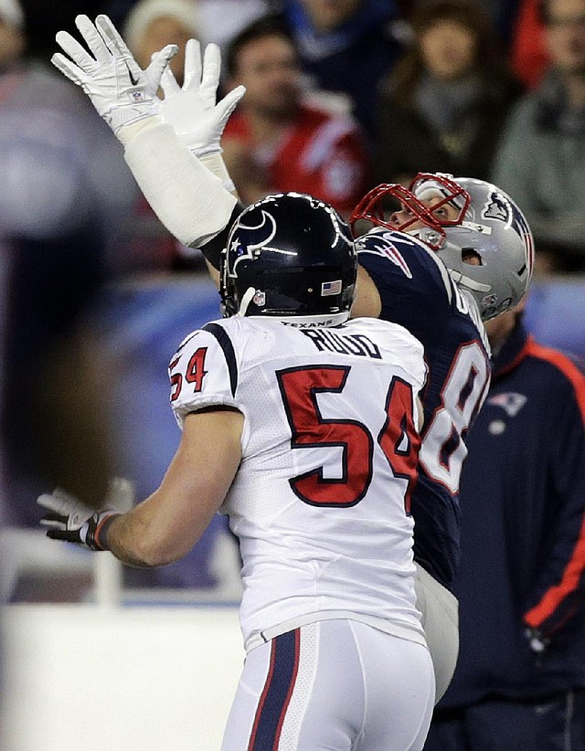 New England Patriots tight end Rob Gronkowski (right) attempts to catch a pass in front of Houston Texans linebacker Barrett Ruud during the first half Sunday in Foxborough, Mass. The pass fell incomplete and Gronkowski was injured on the play and did not return. Gronkowski missed five regular-season games with a broken left forearm. 