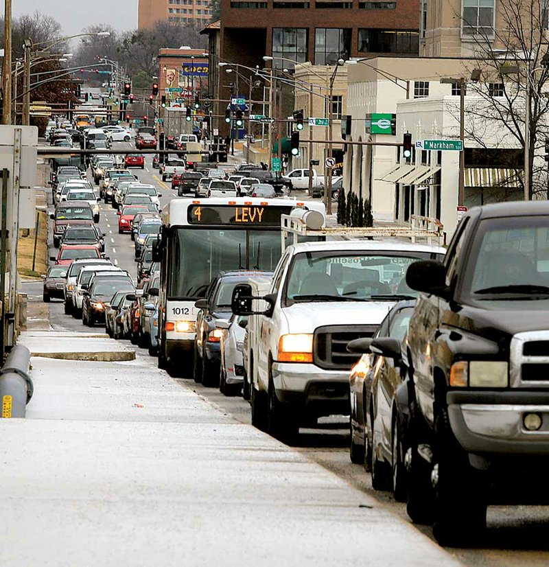 Traffic backs up Tuesday morning in downtown Little Rock as workers leave early because of icy roads. 
