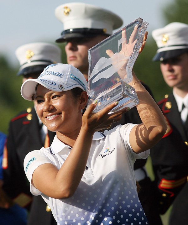 Ai Miyazato holds up the trophy after winning the Walmart NW Arkansas Championship on July 1, 2012 at Pinnacle Country Club in Rogers. 