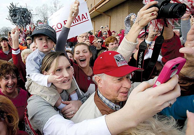 Alabama fans welcome back their national championship football team last week in Tuscaloosa, Ala. A new study shows that SEC schools spent nearly $164,000 per student-athlete in 2010, more than 12 times the amount spent per regular student. 