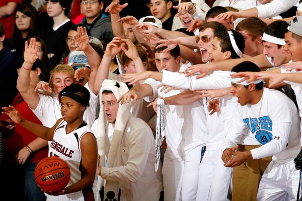 Springdale Har-Ber fans attempt to distract Springdale sophomore Javonda Daniels as she inbounds the ball against Har-Ber during the second half on Tuesday at Springdale High. 