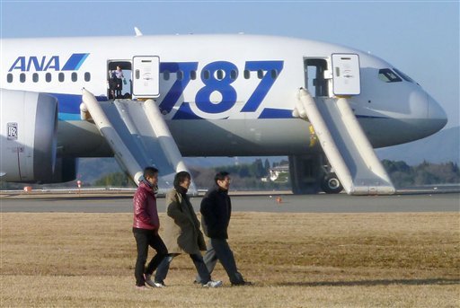 In this photo taken by a passenger and distributed by Japan's Kyodo News, passengers leave an All Nippon Airways Boeing 787 after it made an emergency landing at Takamatsu airport in Takamatsu, Kagawa Prefecture, western Japan, Wednesday, Jan. 16, 2013. ANA said a cockpit message showed battery problems and a burning smell was detected in the cockpit and the cabin, forcing the 787 on a domestic flight to land at the airport.