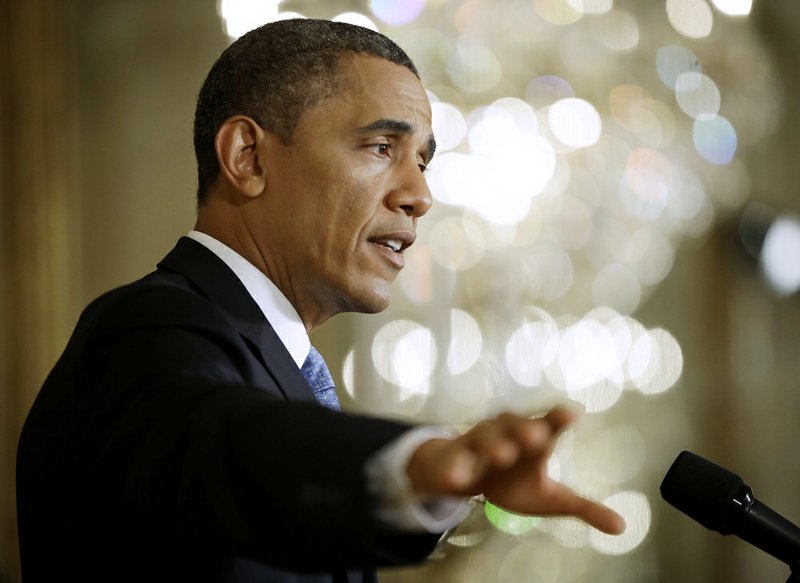 President Barack Obama answers questions in the East Room of the White House in Washington in this Jan. 14, 2103, file photo.