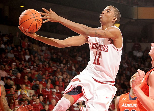 NWA Media/ANTHONY REYES -- Arkansas sophomore BJ Young (11) shoots against Auburn in the second half Wednesday, Jan. 16, 2013 in Bud Walton Arena in Fayetteville. The Razorbacks won 88-80 in double overtime.