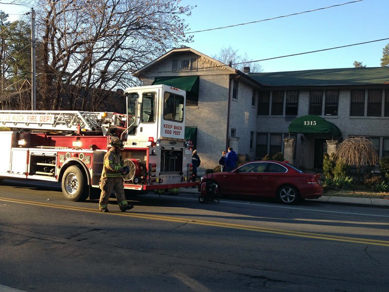 Kavanaugh Boulevard in Little Rock's Hillcrest neighborhood is closed in both directions Thursday, Jan. 17, 2013, as fire crews respond to an apartment blaze.