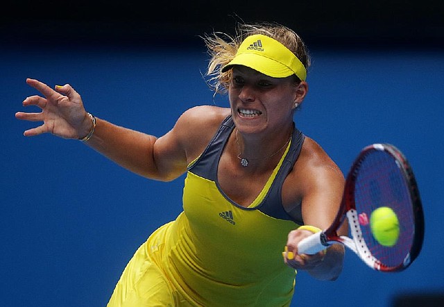 Germany’s Angelique Kerber, the No. 5 seed in the women’s draw, hits a forehand to Madison Keys of the United States during a 6-2, 7-5 victory at the Australian Open. 