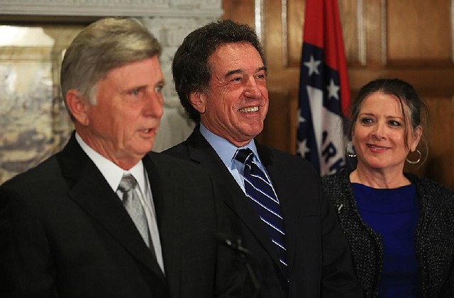 Gov. Mike Beebe named Robert S. Moore Jr. (center) of Arkansas City to the Arkansas Highway Commission on Thursday. Moore was speaker of the House in the previous Legislature. 