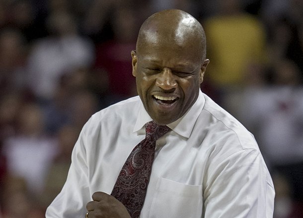 Arkansas head coach Mike Anderson celebrates at the end of the second overtime an NCAA college basketball game against Auburn in Fayetteville, Ark., Wednesday, Jan. 16, 2013. Arkansas defeated Auburn 88-80. (AP Photo/Gareth Patterson)