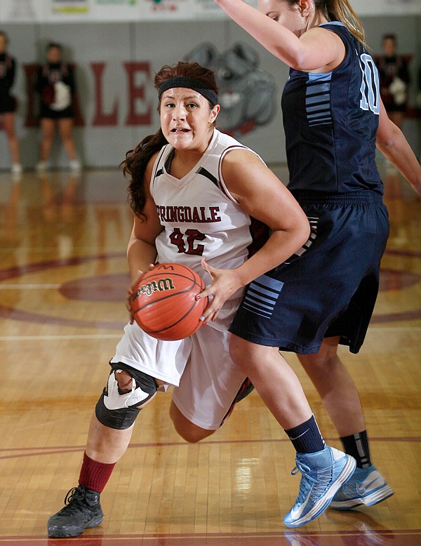 Karen Perez, a Springdale junior, drives to the basket against Springdale Har-Ber during Tuesday’s game at Springdale High. 