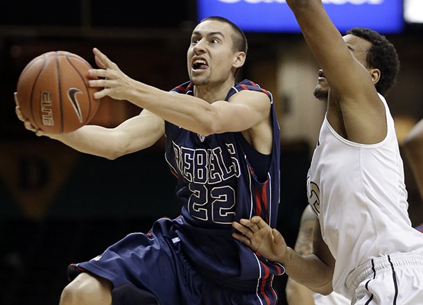 Mississippi guard Marshall Henderson (22) drives past Vanderbilt guard Kevin Bright, right, in the first half of an NCAA college basketball game on Tuesday, Jan. 15, 2013, in Nashville, Tenn. (AP Photo/Mark Humphrey)