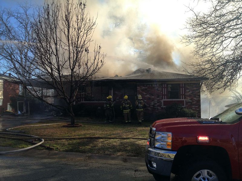 Firefighters respond Friday, Jan. 18, 2013, to a house blaze at 52nd and Schaer streets in North Little Rock.