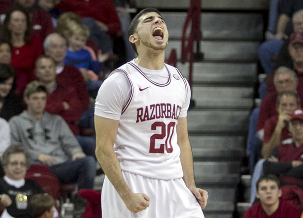 Arkansas' Kikko Haydar (20) celebrates after an Arkansas basket during the second half an NCAA college basketball game in Fayetteville, Ark., Saturday, Jan. 12, 2013. Arkansas defeated Vanderbilt 56-33. (AP Photo/Gareth Patterson)