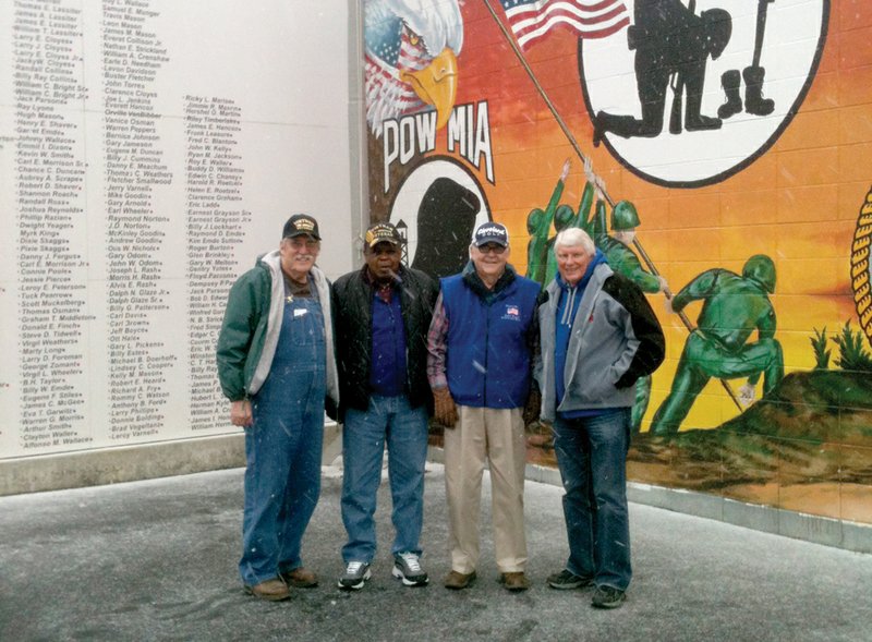 From the left, Kenneth Morris, Carl White, Bald Knob Mayor Doyle Wallace and Clois Cox stand in front of the Veterans Memorial Wall in Bald Knob. The wall, which has been finished for about four months, took almost 13 months to complete. 