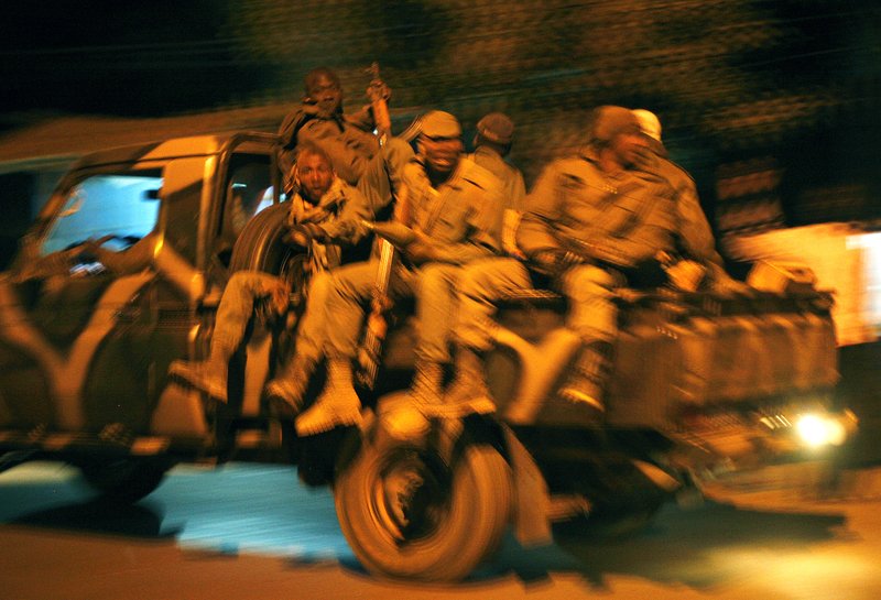 Malian soldiers jubilate as they return to Niono, from Diabaly, some 400 kms (300 miles) North of the capital Bamako, Saturday Jan. 19, 2013. French troops encircled a key Malian town on Friday, trying to stop radical Islamists from striking against communities closer to the capital and cutting off their supply line, a French official said. The move around Diabaly came as French and Malian authorities said that the city whose capture prompted the French military intervention in the first place was no longer in the hands of the extremists. 