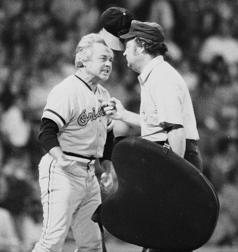 Baltimore Orioles Manager Earl Weaver “flips his lid” as he protests a call by home plate umpire Marty Springstead during a game against the Chicago White Sox on July 13, 1974. Weaver, the fiery Hall of Fame manager who won 1,480 games with the Baltimore Orioles, died Saturday. He was 82. 