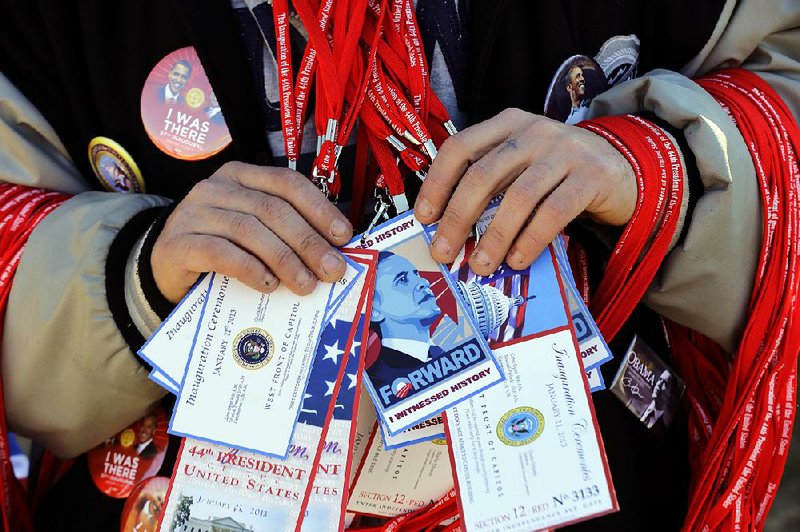 A vendor holds items for sale on the National Mall on Sunday in Washington. 