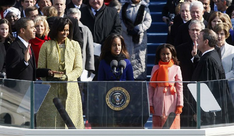 U.S. Chief Justice John Roberts (right) gives the ceremonial oath of office to President Barack Obama during Obama’s ÿrst inaugural ceremonies on Jan. 20, 2009. 