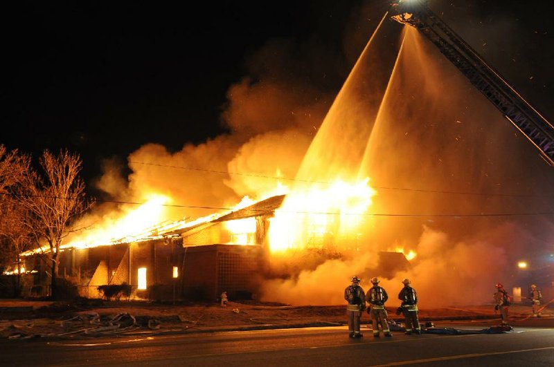 Springdale firefighters respond to a fire at an abandoned church Sunday, Jan. 20, 2013 on the north east corner of Grove Avenue and Thompson Street in Springdale.