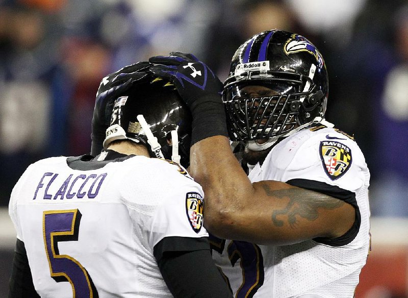 Baltimore Ravens linebacker Ray Lewis (right) celebrates with quarterback Joe Flacco near the end of the second half of Sunday’s AFC Championship Game against the New England Patriots in Foxborough, Mass. The Ravens won 28-13 to advance to Super Bowl XLVII. Lewis is the only Ravens player still on the team from its last Super Bowl appearance at the end of the 2000 season. 