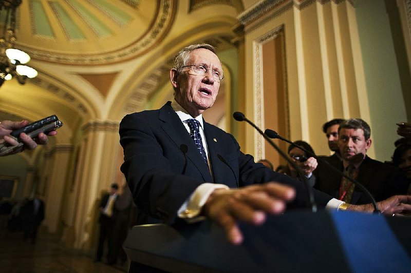 Senate Majority Leader Harry Reid, D-Nev., speaks with reporters following a Democratic strategy session at the Capitol in Washington, Tuesday, Jan. 22, 2013. (AP Photo/J. Scott Applewhite)