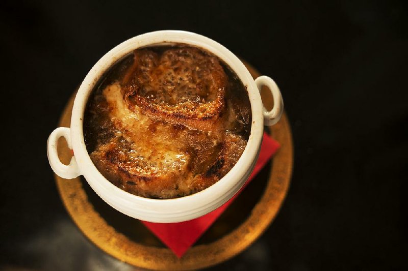 French Onion Soup. Gooey, bubbling cheese and caramelized onions certainly make French onion soup enticing, but it is the stock that makes the difference. Illustrates TECHNIQUE (category d), by David Hagedorn, special to The Washington Post. Moved Monday, Jan. 7, 2013. (MUST CREDIT: Washington Post photo by Tracy A. Woodward.)