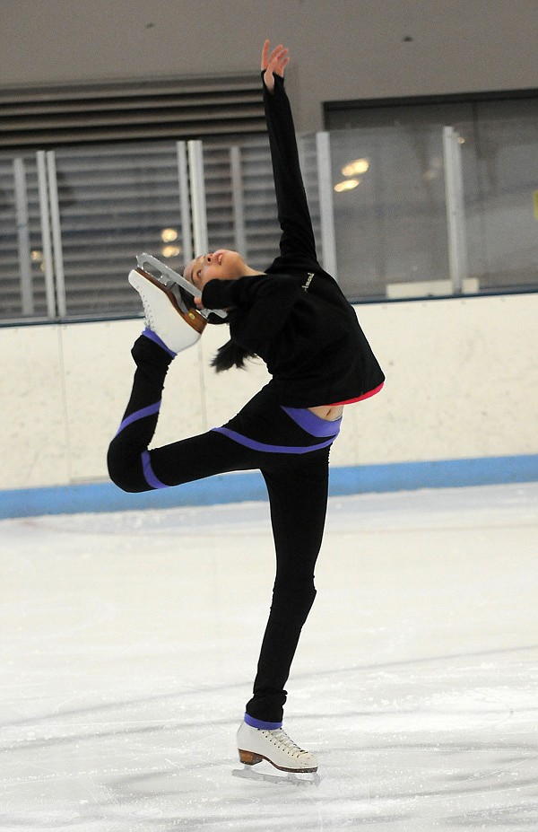 Amanda Thomsen, 10, attempts a Biellmann spin during the Ozark Figure Skating Club’s ice time at the Jones Center in Springdale. The OFSC formed in 1997 and became a member of U.S. Figure Skating in 1999. The club is open to all skaters from novice to advanced. 