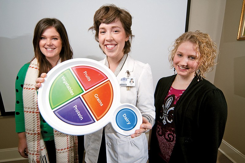 Krista Petty, right, has been trying to get a wellness/nutrition series started for the Saline County Library System. Now, she and the libraries are collaborating with Saline Memorial Hospital, including hospital employees Rebecca Jones, left, and dietitian Ashley Tappe, to put the program into place.