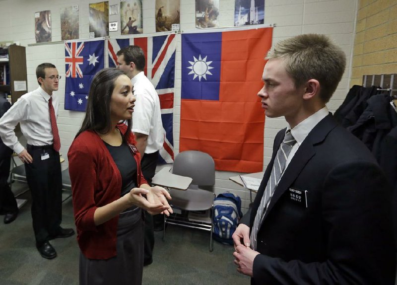 Mormon missionaries Mikaela Merrill, 19 and Harrison Surdu practice Mandarin Chinese during class at the Missionary Training Center in Provo, Utah. The church’s recent decision to lower the minimum age for missionaries has been greeted with enthusiasm from many young members, especially women. 