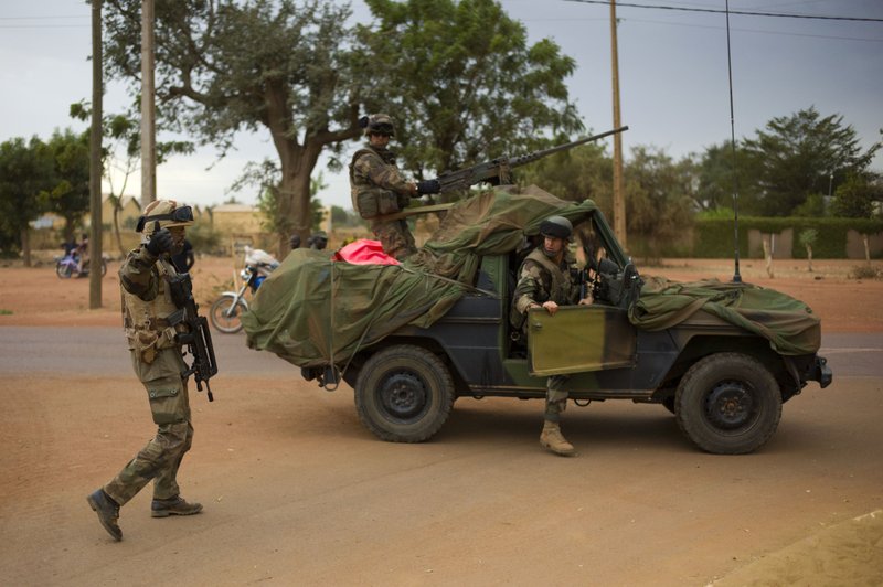 French soldiers stand at a crossroads as they arrive in the city of Sevare, Mali, some 620 kms (385 miles) north of Bamako, Friday, Jan. 25, 2013. Mali's military and French forces pushed toward Gao on Friday, in their farthest move north and east since launching an operation two weeks ago to retake land controlled by the rebels, residents and a security official said Friday.