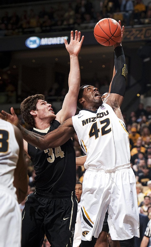 Missouri’s Alex Oriakhi (42) grabs a rebound in front of Vanderbilt’s Shelby Moats (34) in the first half of the Tigers’ 81-59 victory Saturday in Columbia, Mo. Oriakhi had 18 points and a game-high 12 rebounds in the victory. 